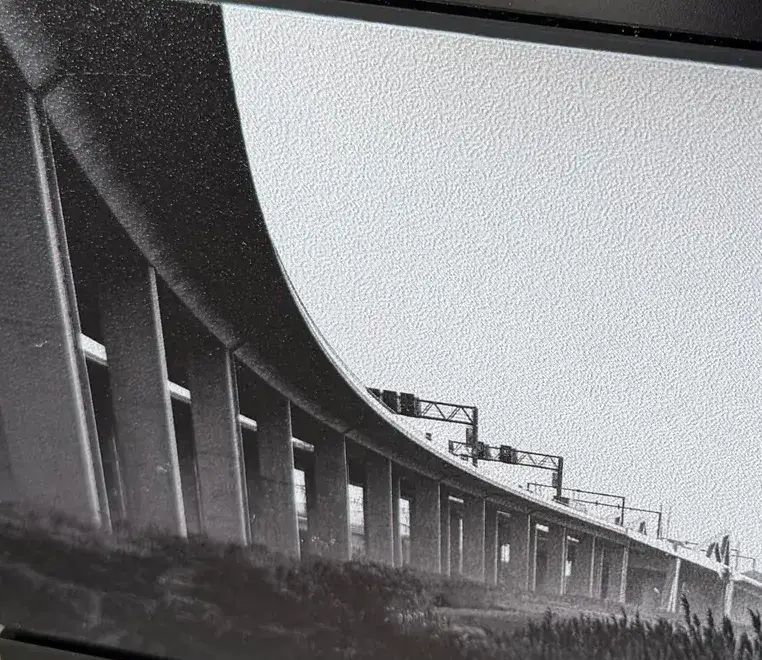 A black and white viaduct photo printed on a faceplate