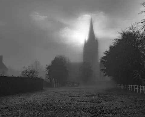 Spire in fog